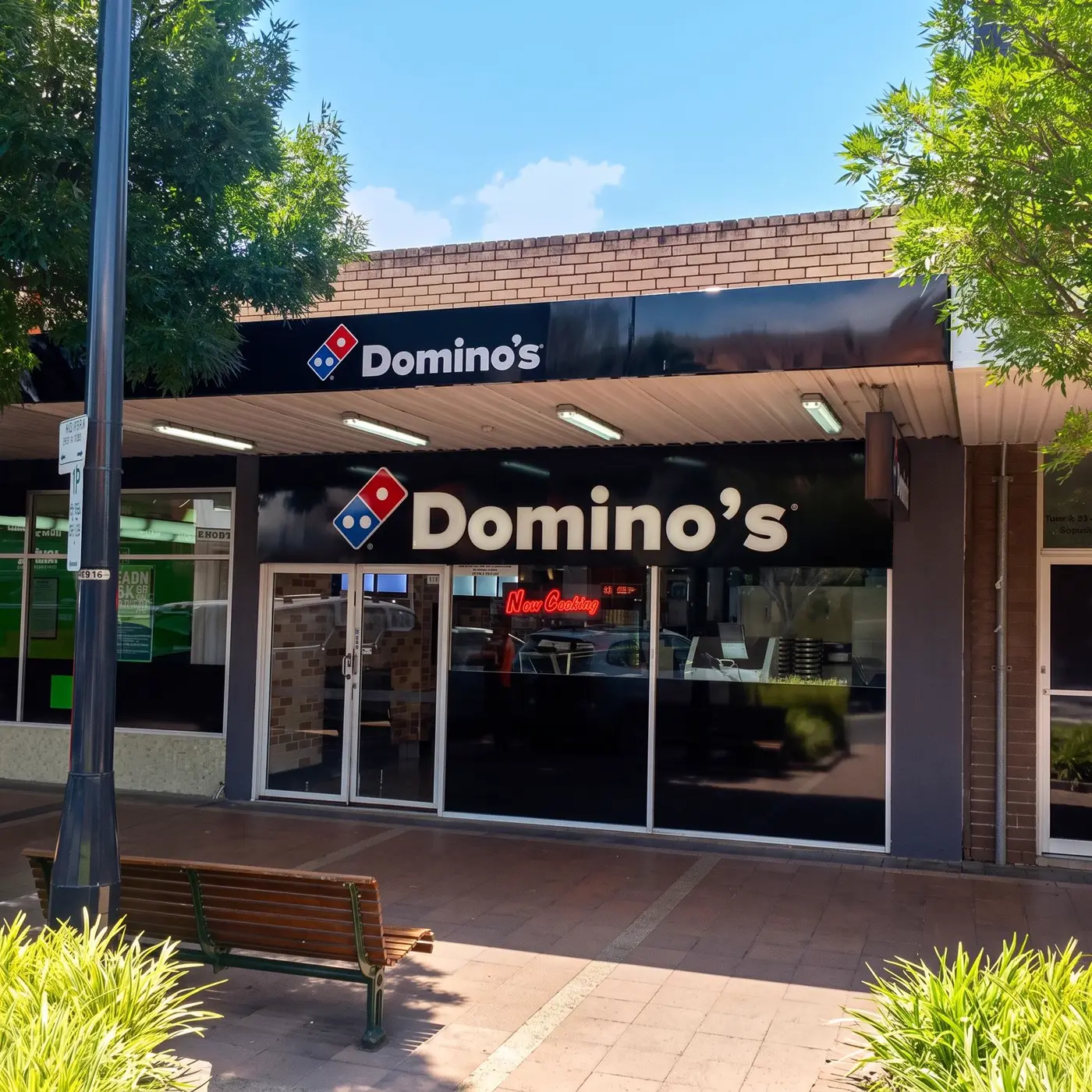Domino's storefront with parapet fascia sign and illuminated 3D letters